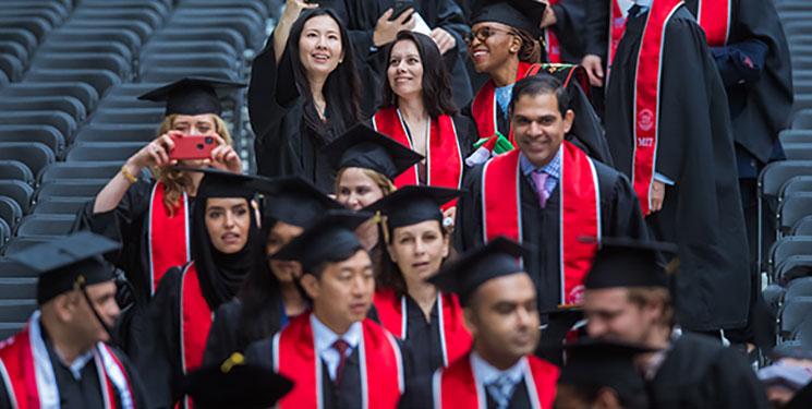 Students with graduation caps. 